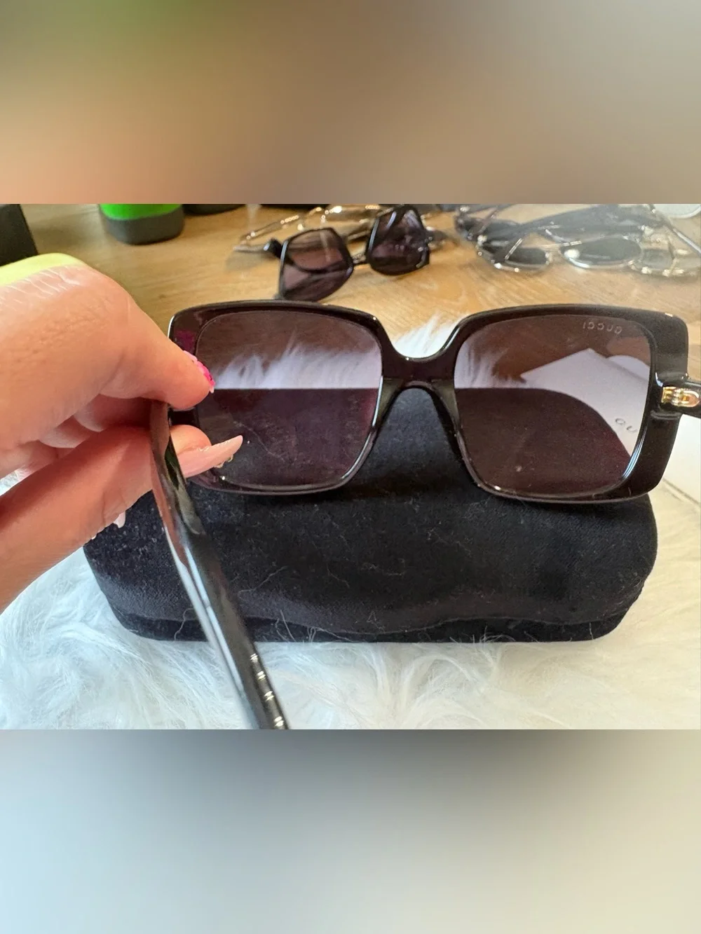 Gucci Black Frame Sunglasses with Gold Logo Detailing